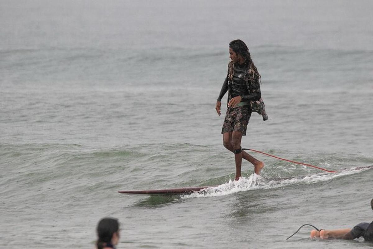 a woman on a surfboard in the water