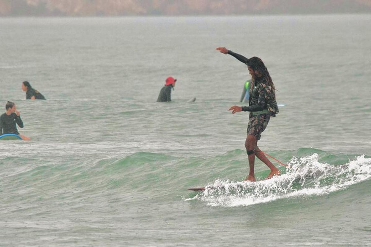 a man riding a wave on a surfboard in the ocean