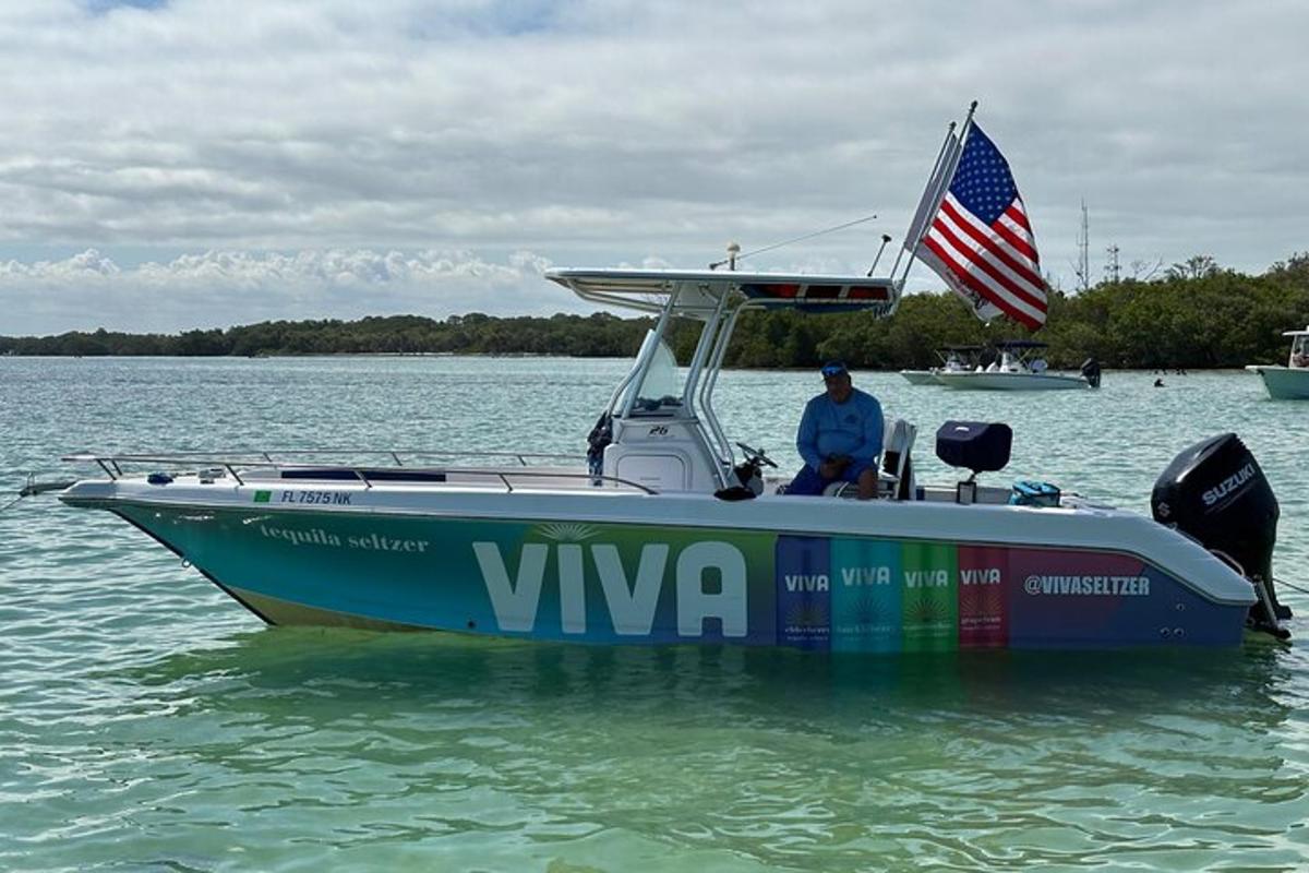 a man is sitting on a boat in the water