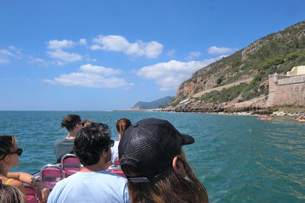 a group of people on a boat in the water