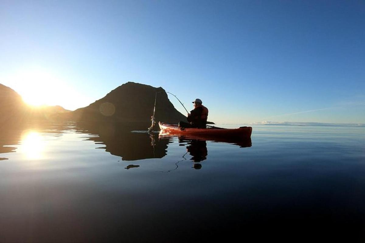 a man is in a boat on the water