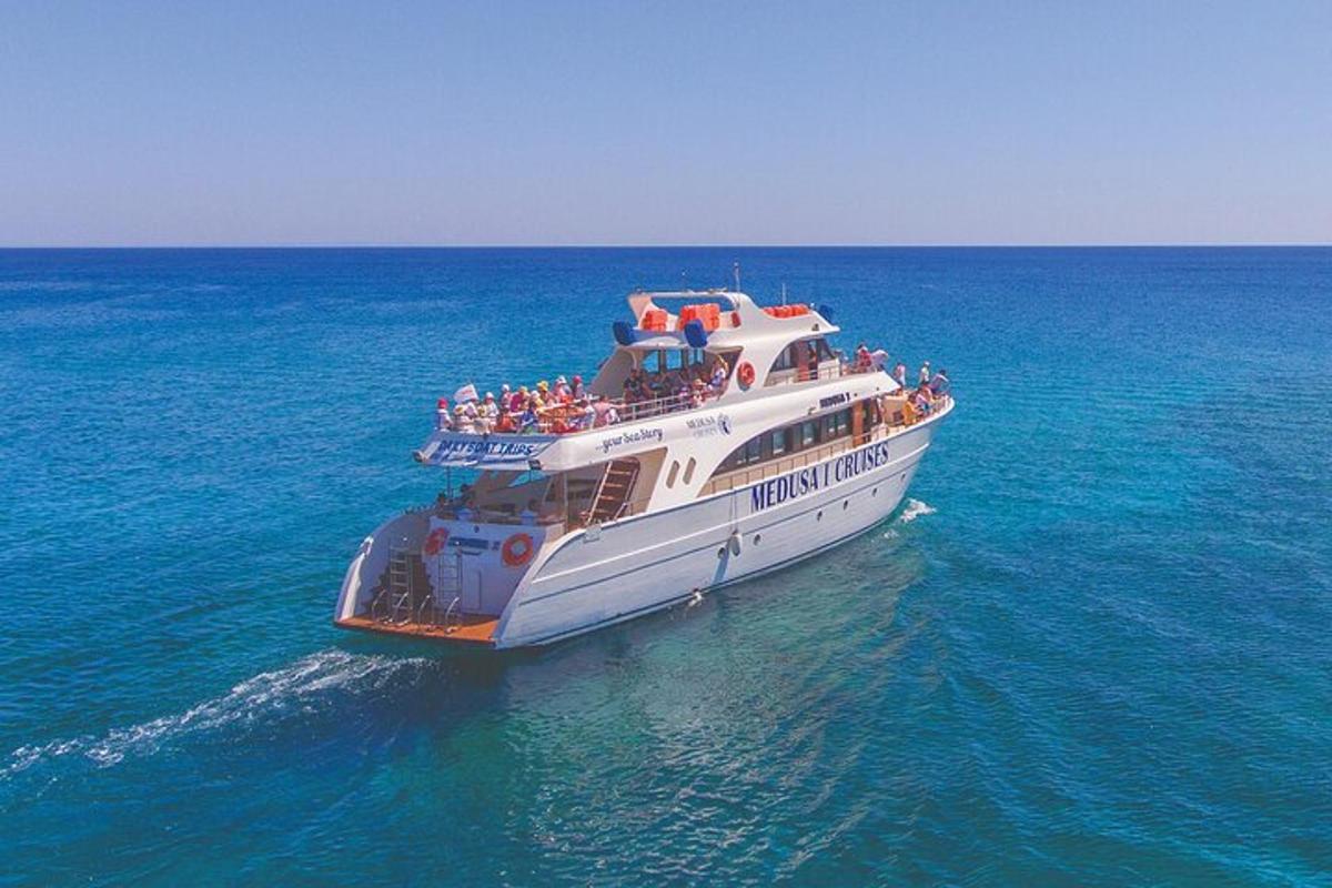a large boat in the ocean with people on it