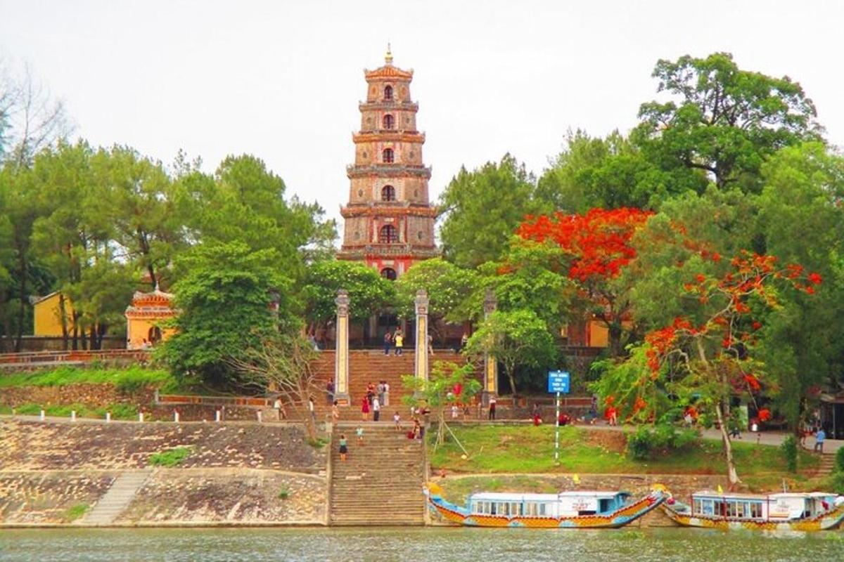 a building with a clock tower next to a body of water