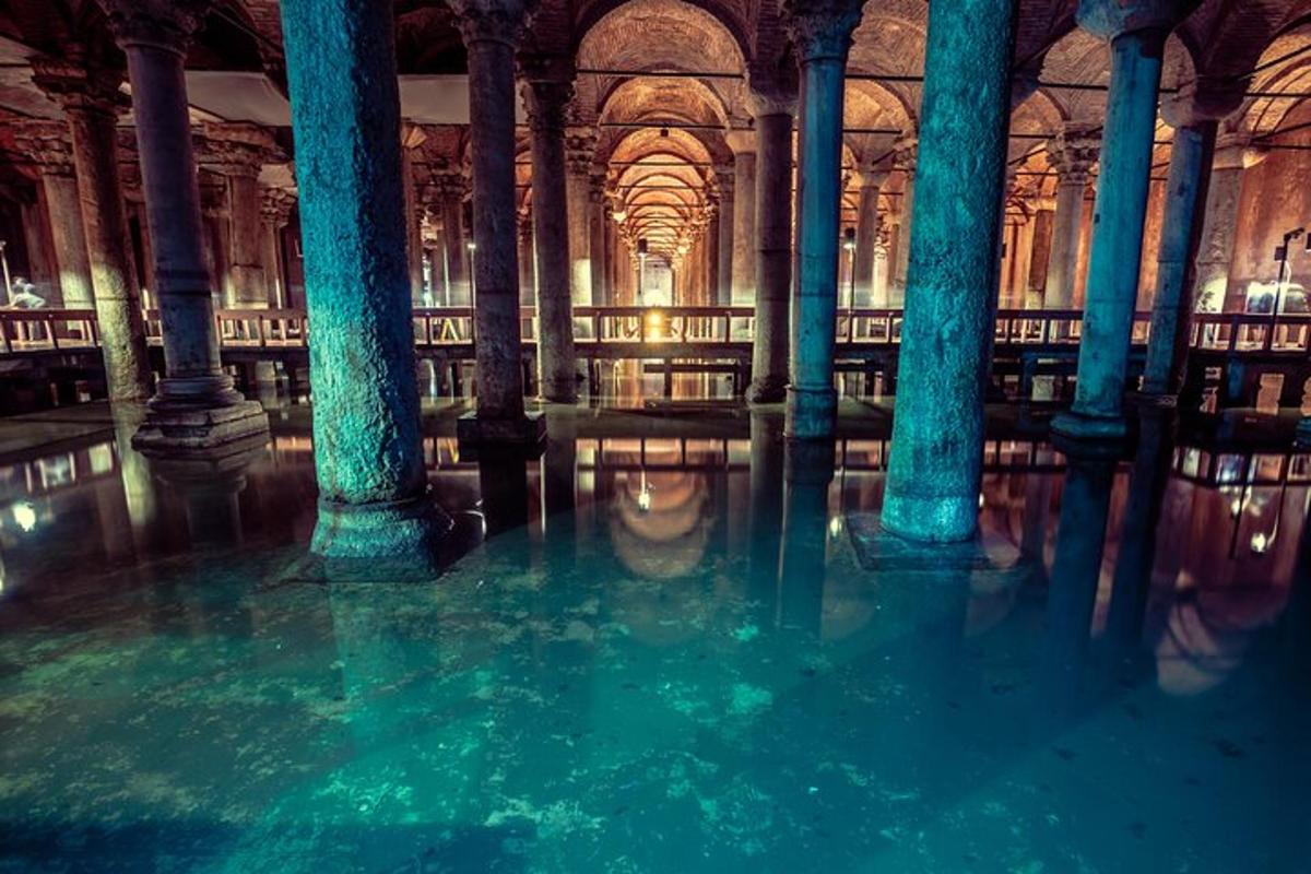 a room with columns and water in a library