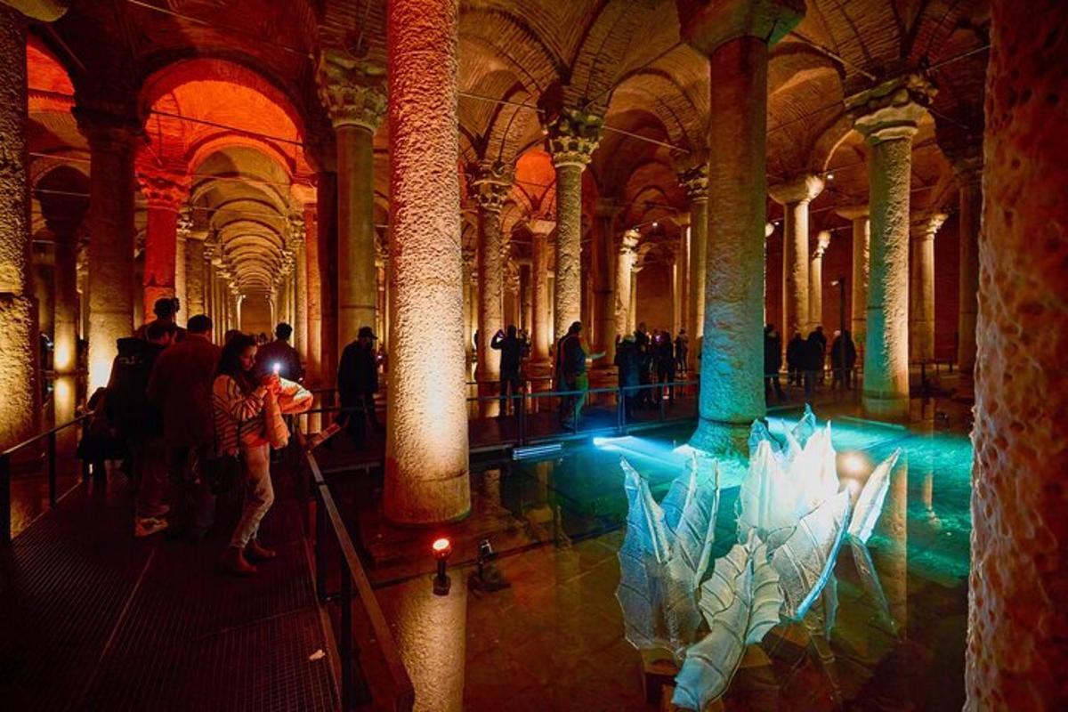 a group of people in a large building with columns