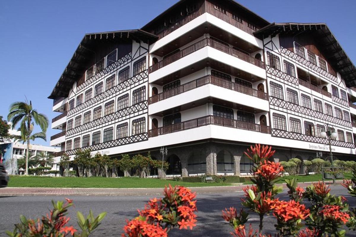 a large building with flowers in front of it