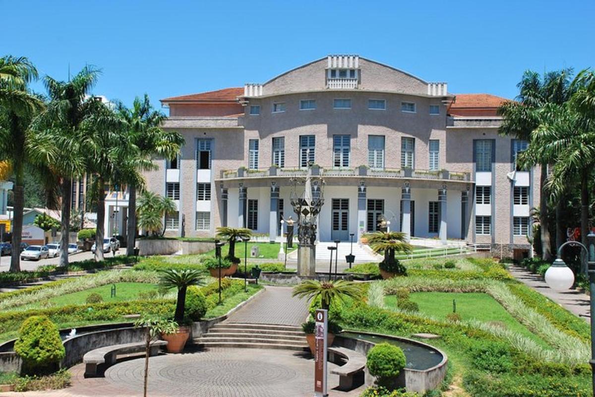 a large building with a garden in front of it