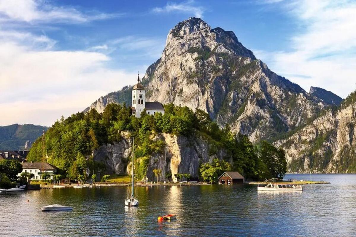 a church on top of a mountain on a body of water