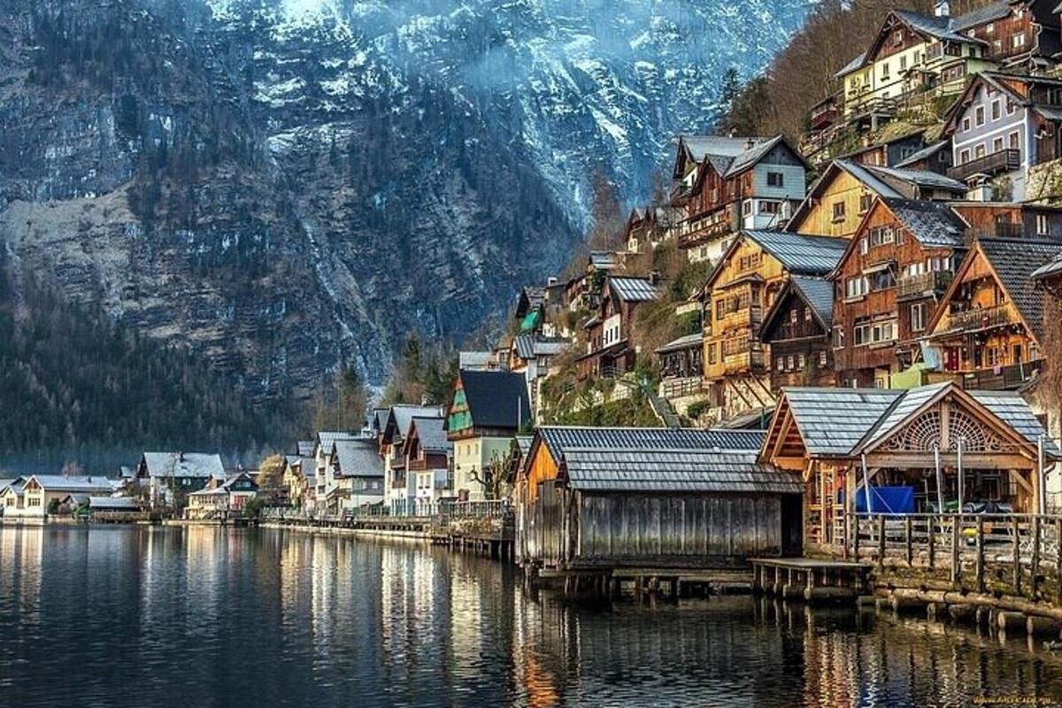a town on a mountain with a body of water