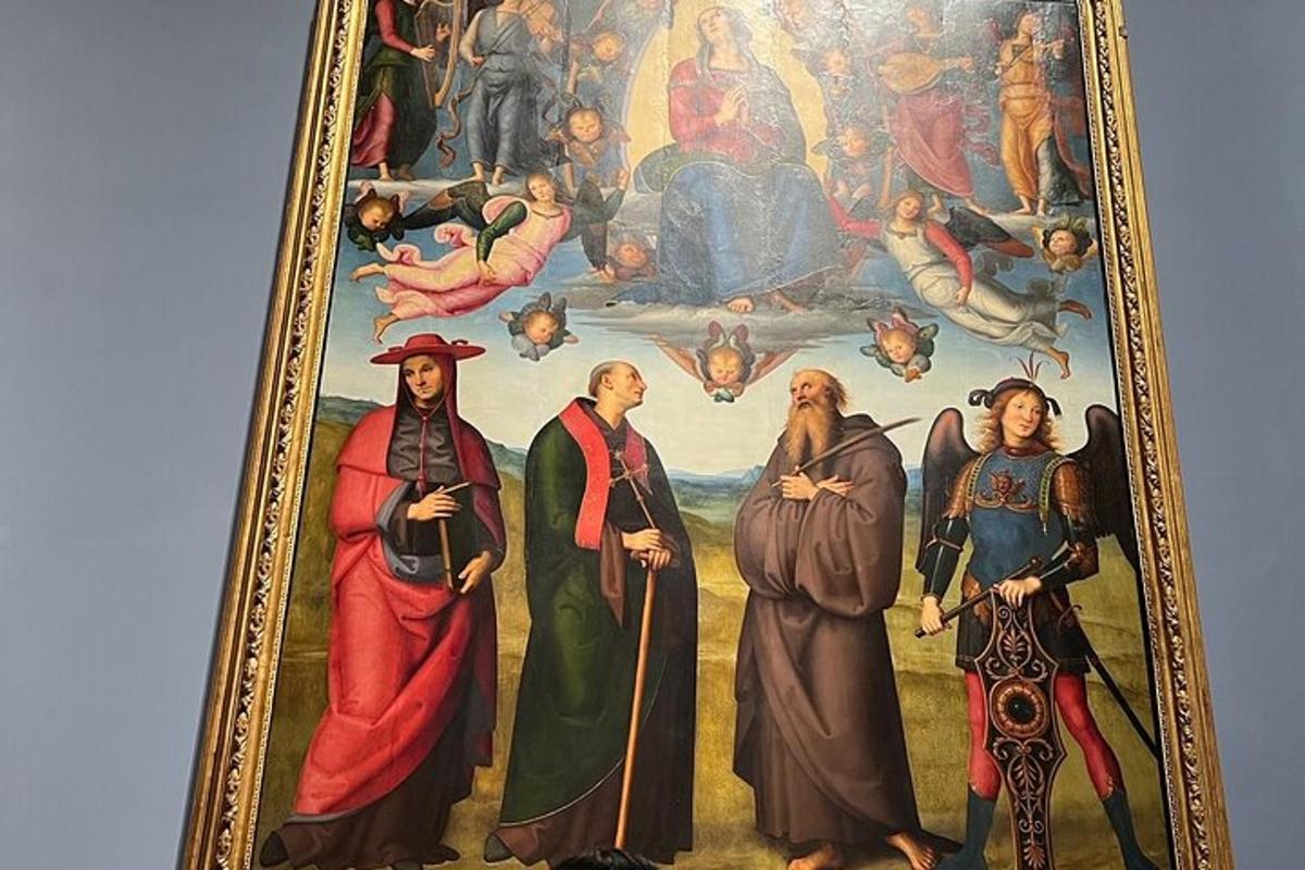 una pintura d'un grup de persones en una paret