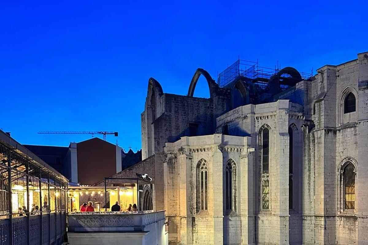 a large stone building with a building in the background