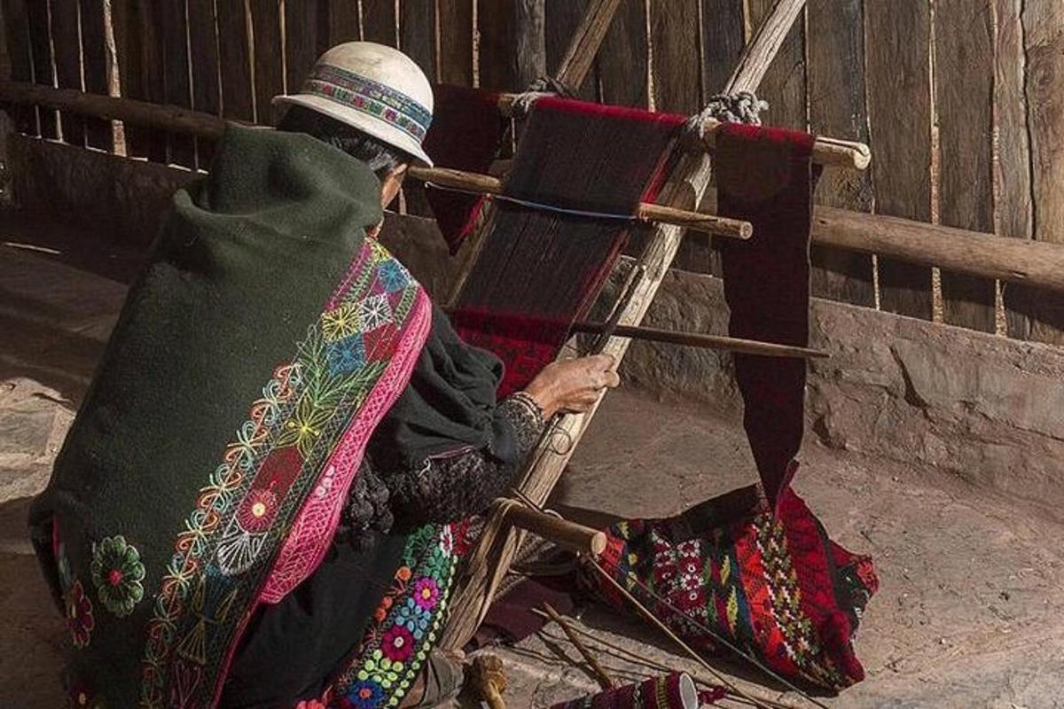 a woman sitting on a chair with a hat