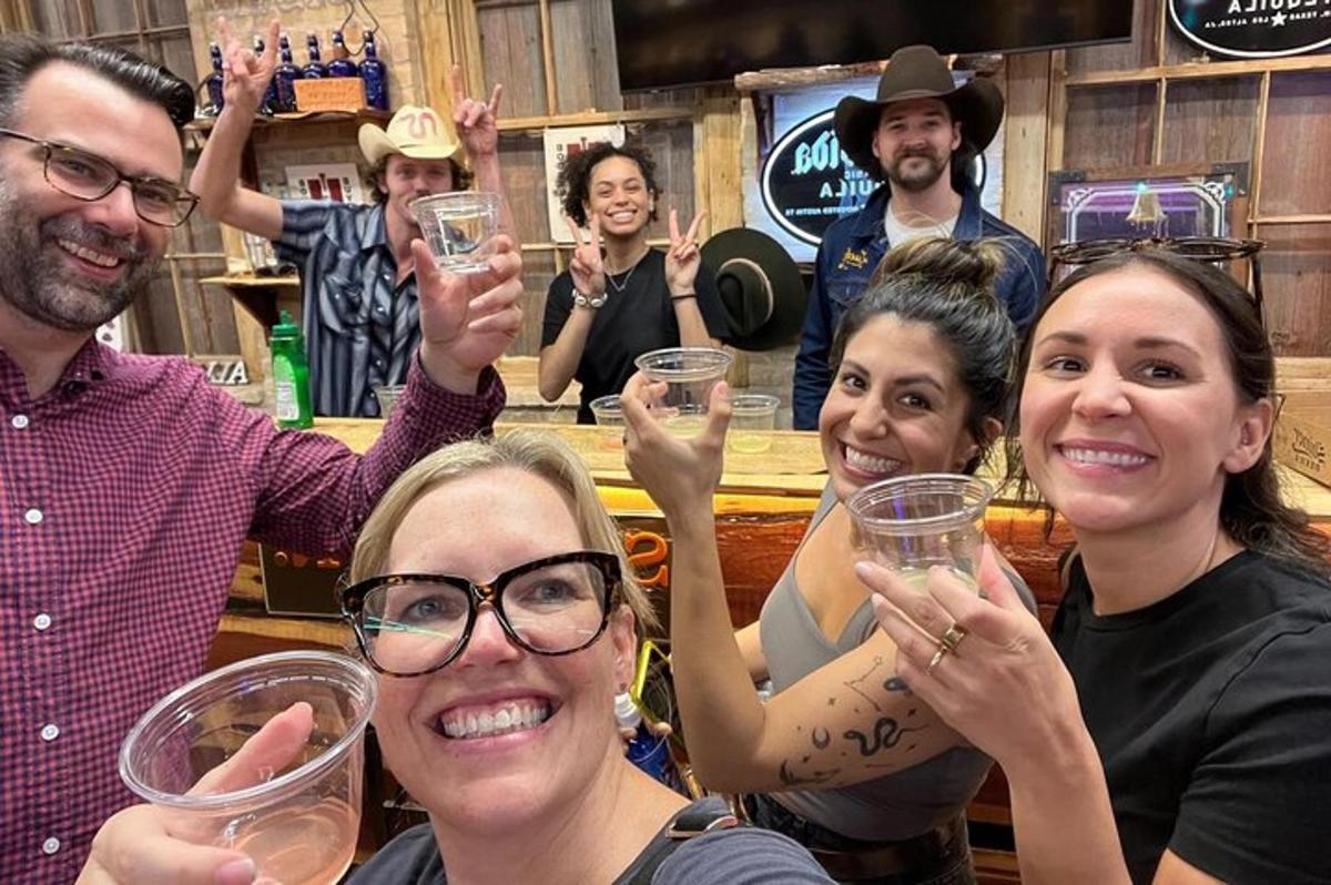 a group of people holding up their wine glasses