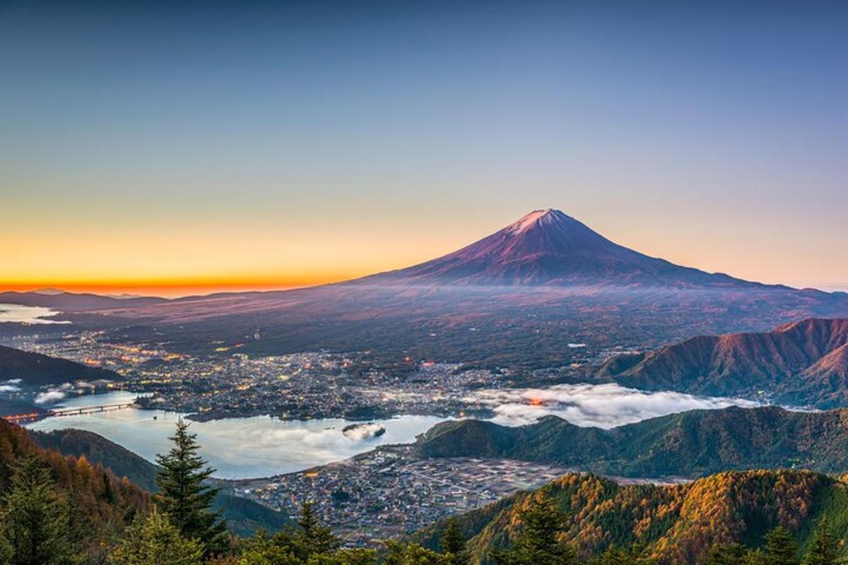 a view of a mountain with a town and a city