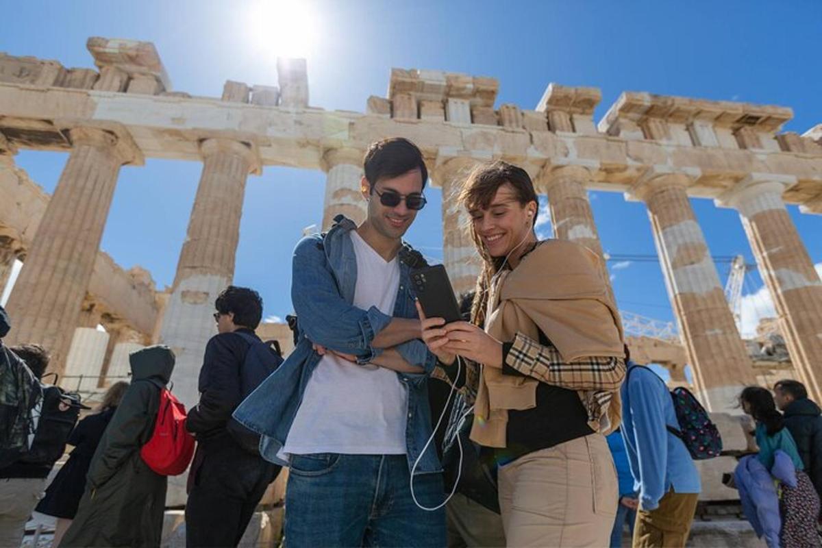 two people are standing in front of a building