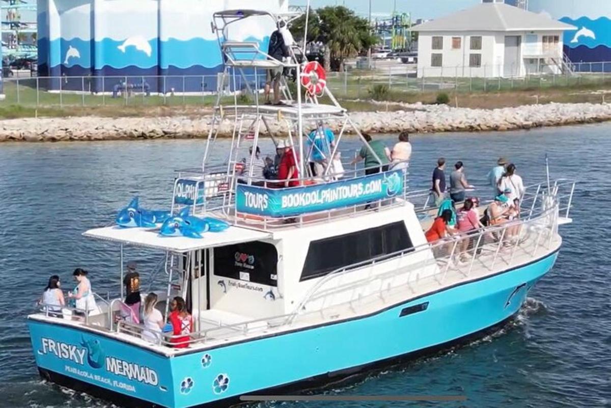 a group of people on a boat in the water
