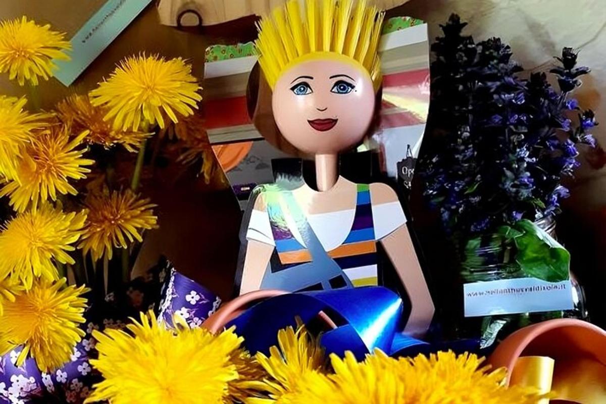 a statue of a man with a pineapple head and flowers