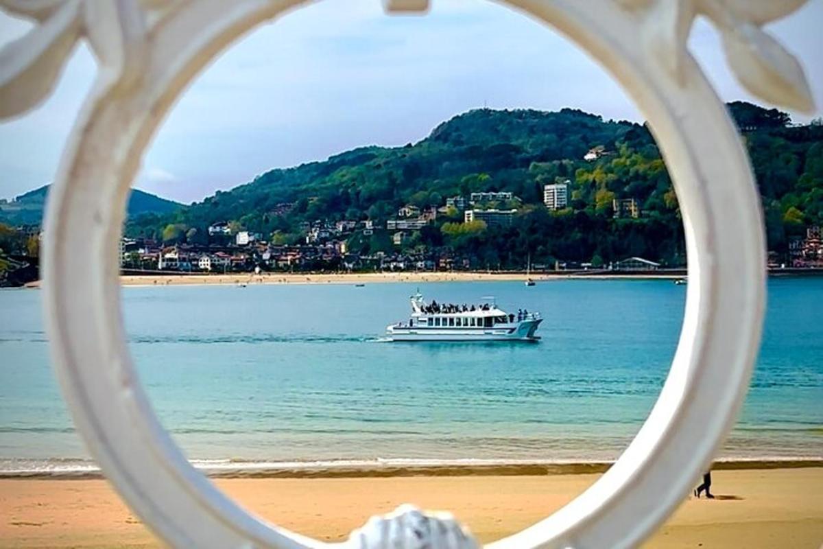 a boat floating in the water on a beach