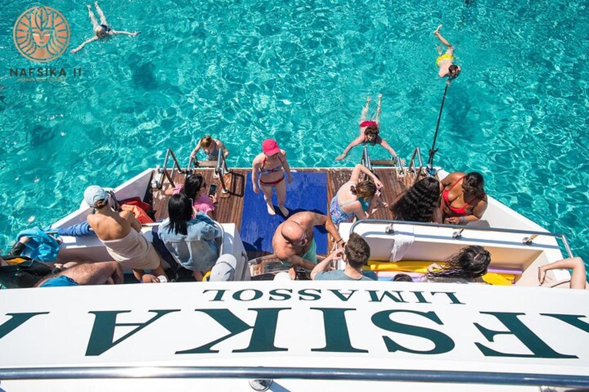 a group of people on a boat in the water