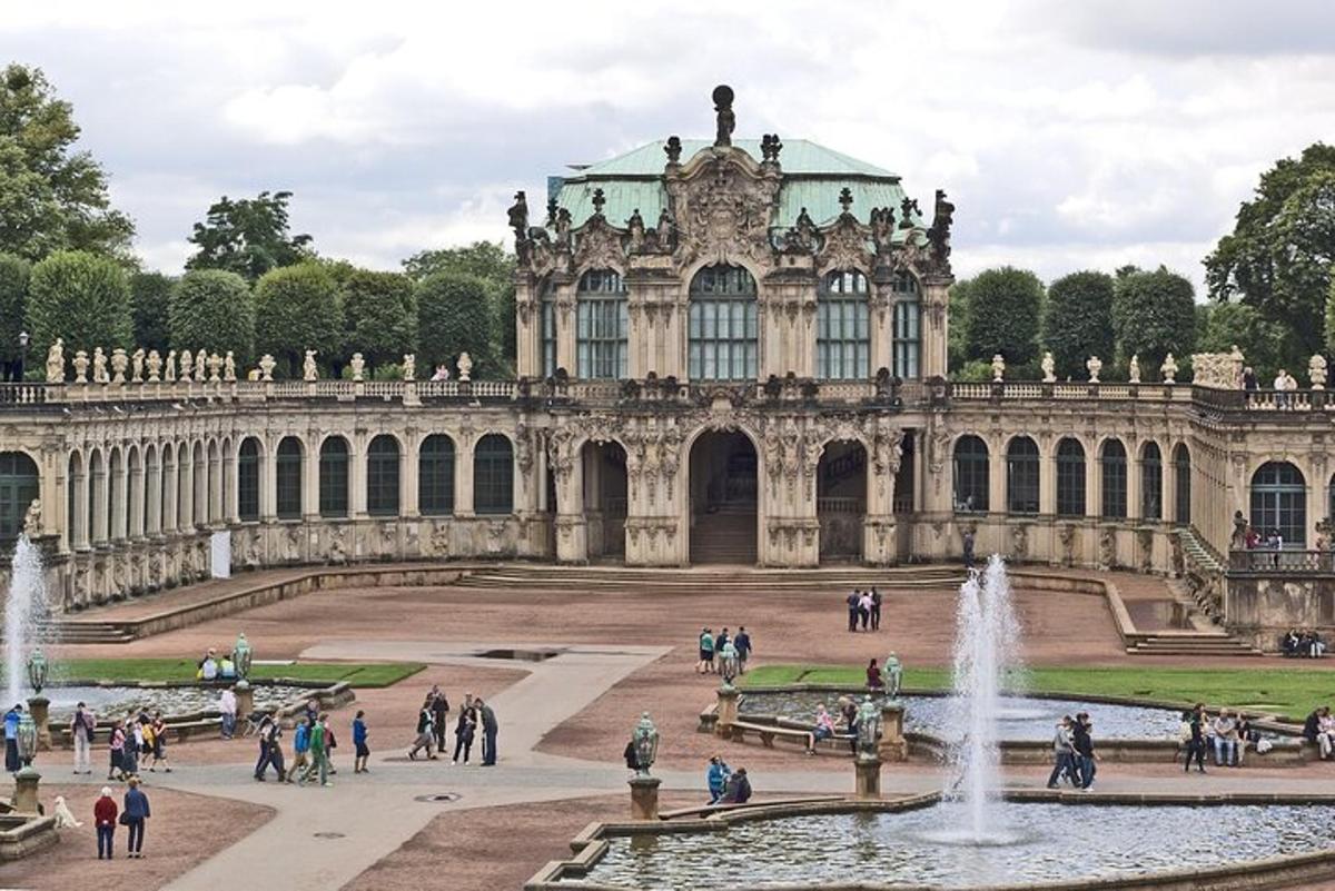 a large building with a fountain in front of it