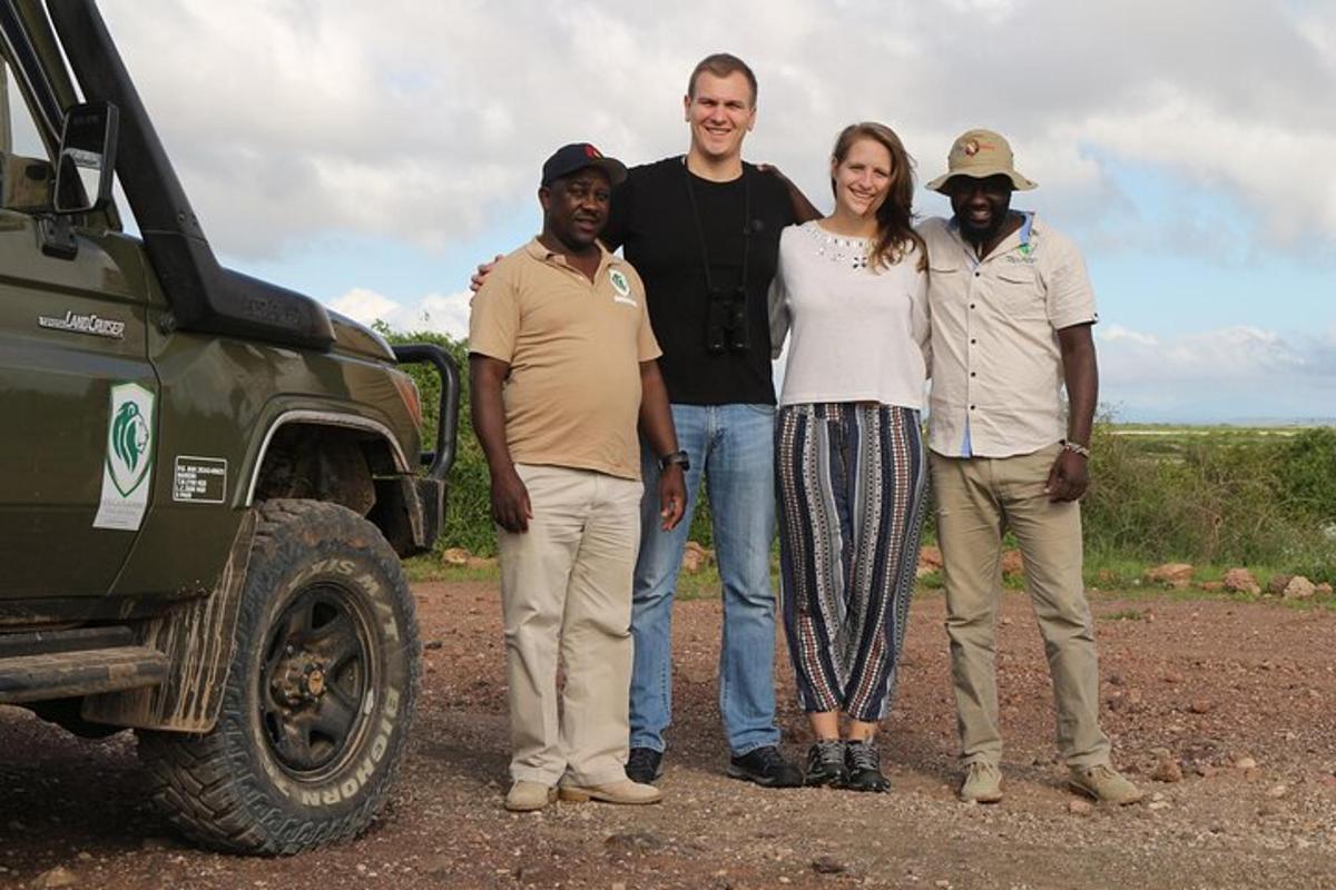 a group of people standing in front of a truck