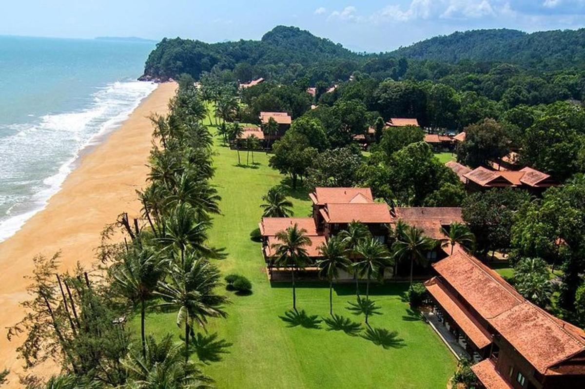 an aerial view of a resort on the beach