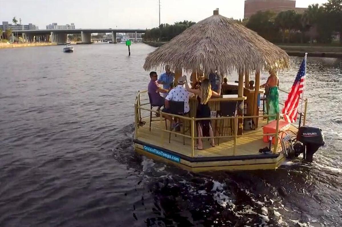 a group of people on a boat in the water
