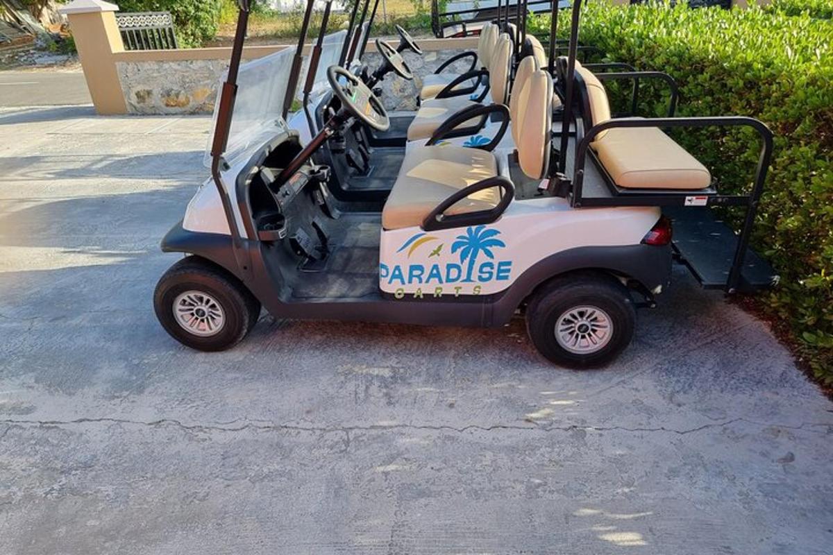 a golf cart is parked in a driveway