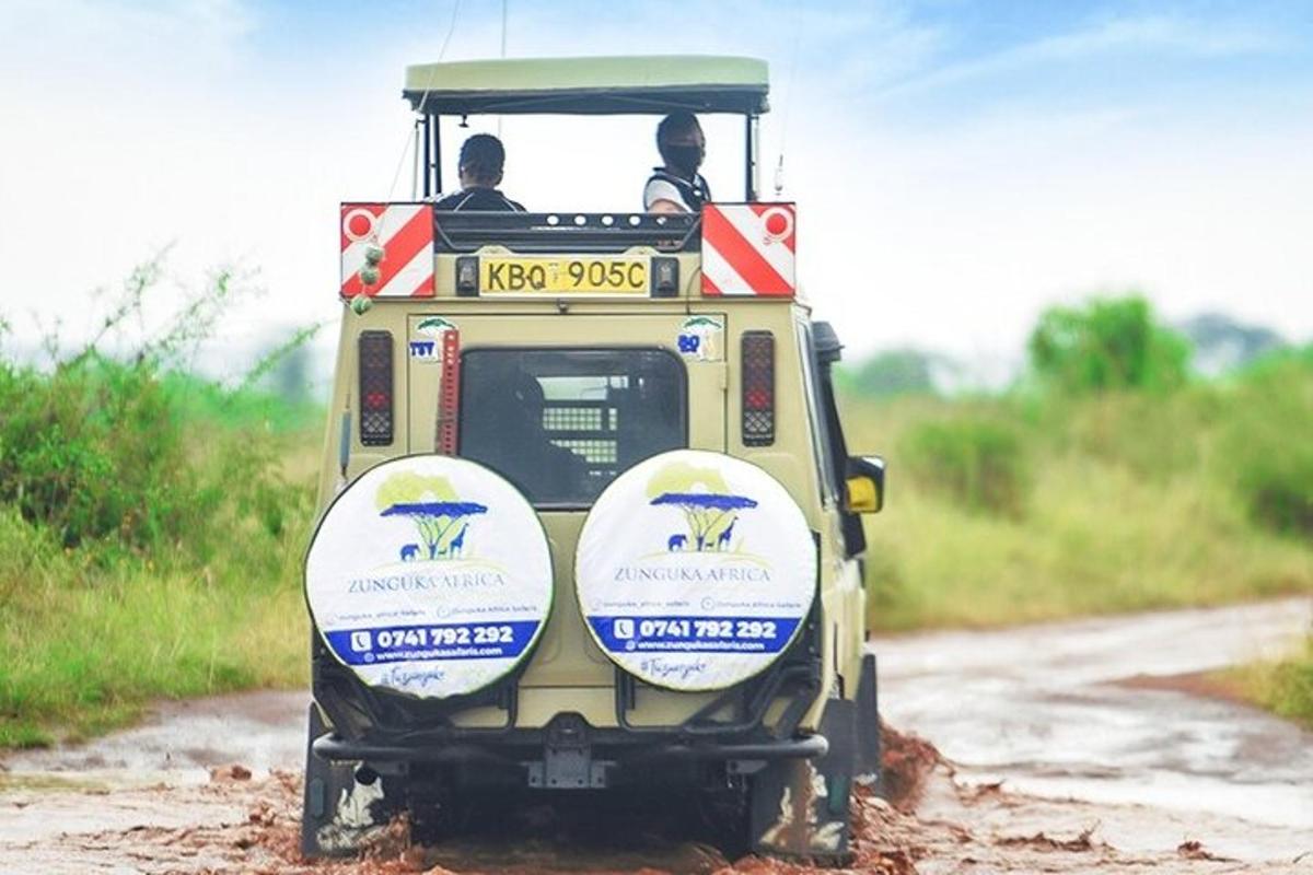 a small vehicle driving down a dirt road