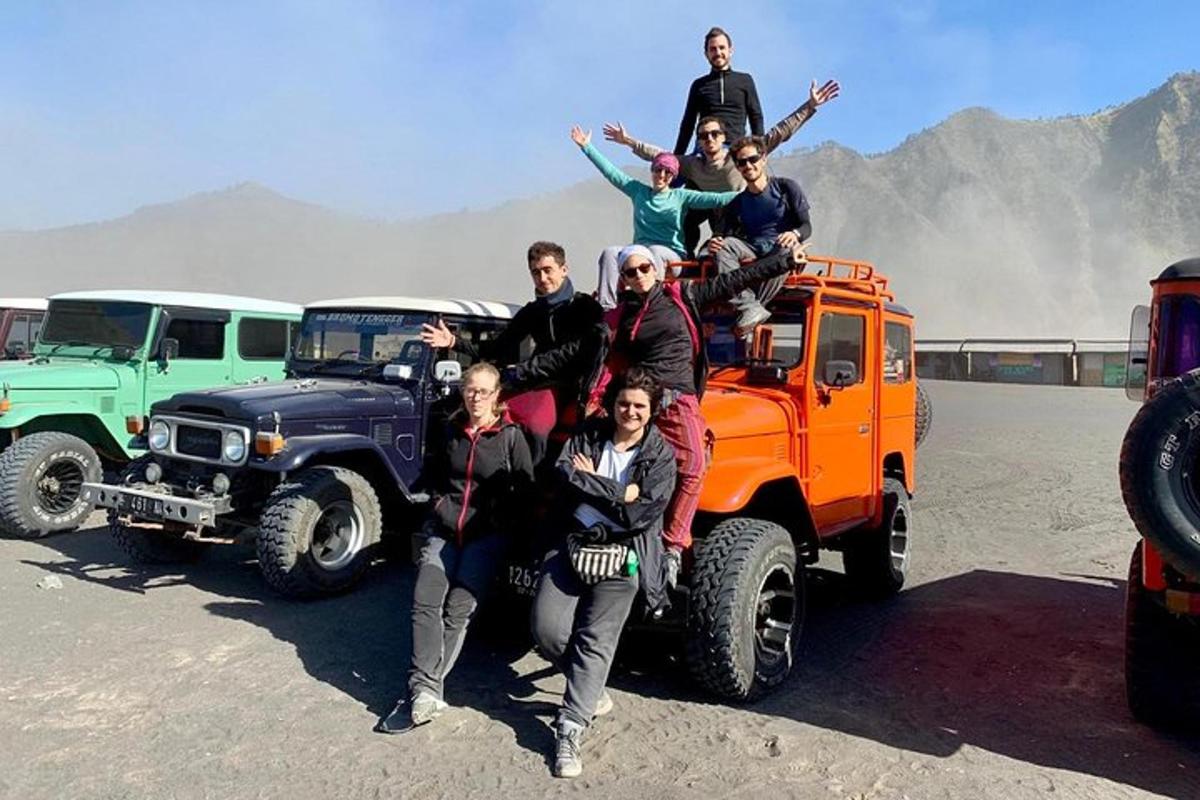 a group of people standing on the back of a truck