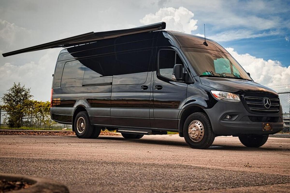 a van parked on a road with its door open