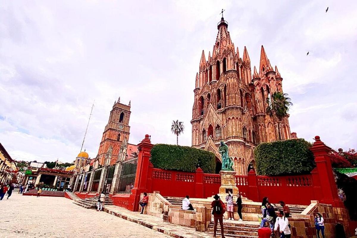 a large cathedral with people standing in front of it