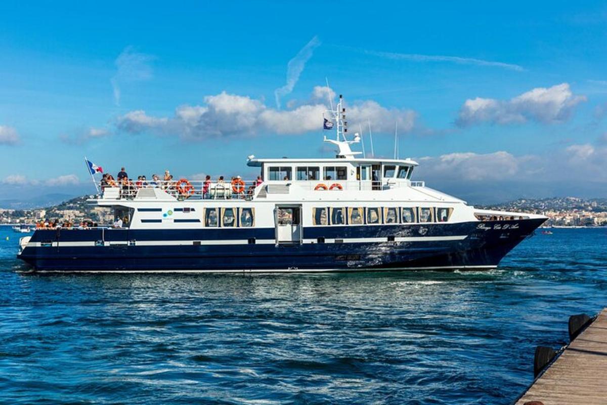 a ferry boat in the water near a pier