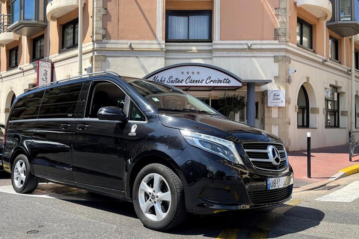 a black suv parked in front of a building