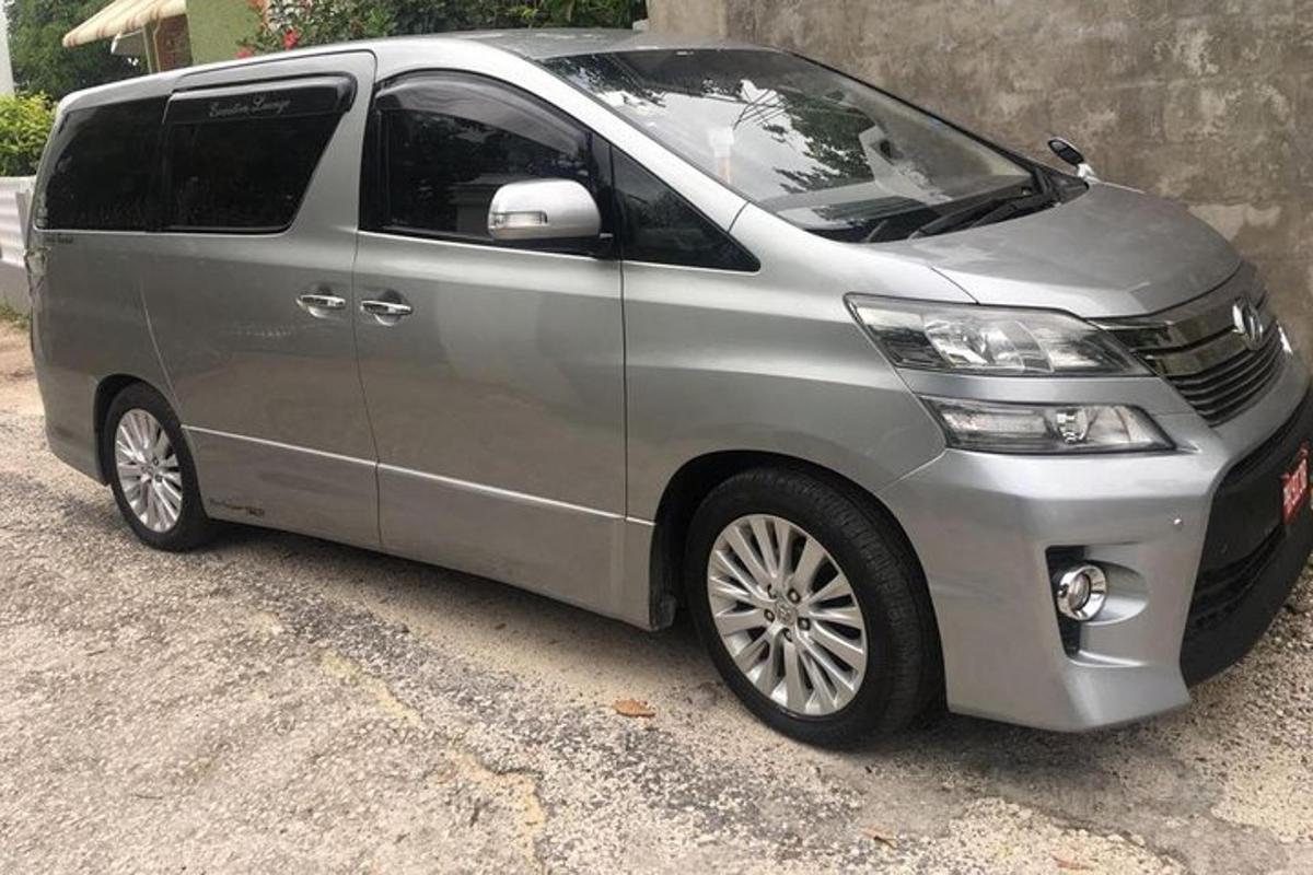 a silver van parked next to a building