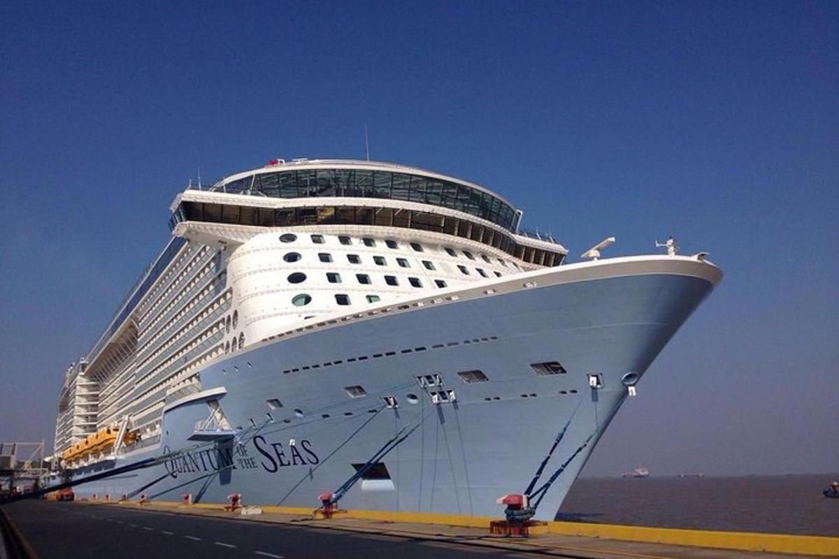 a large cruise ship is docked in the ocean