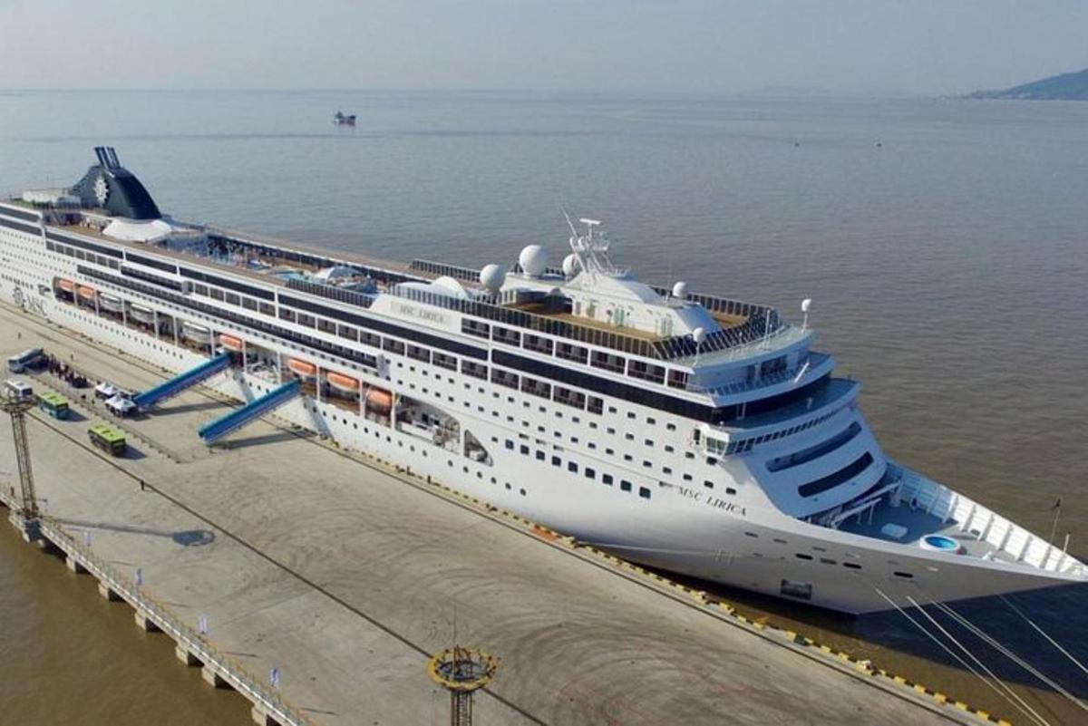 a cruise ship is docked at a dock