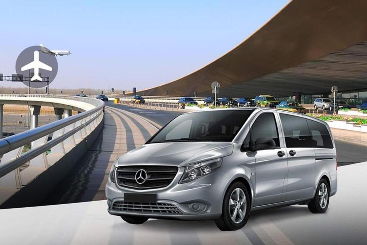 a silver van is parked on a bridge