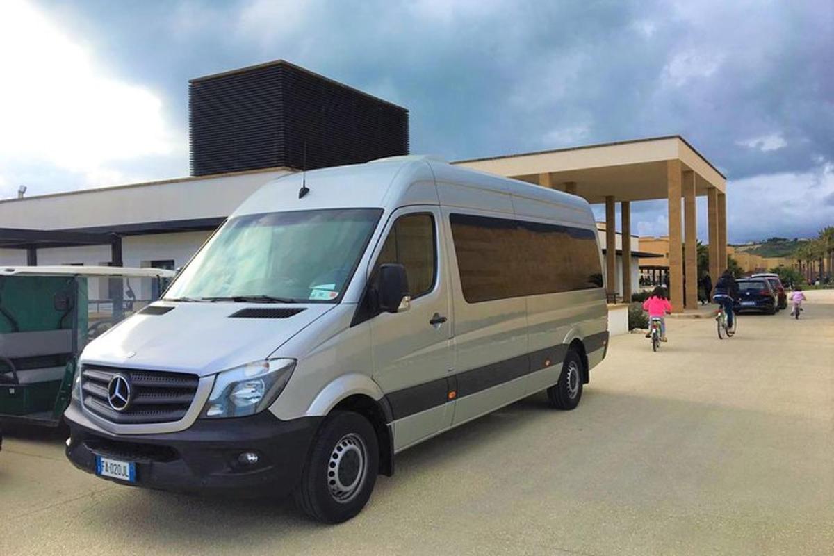a white van parked in front of a building