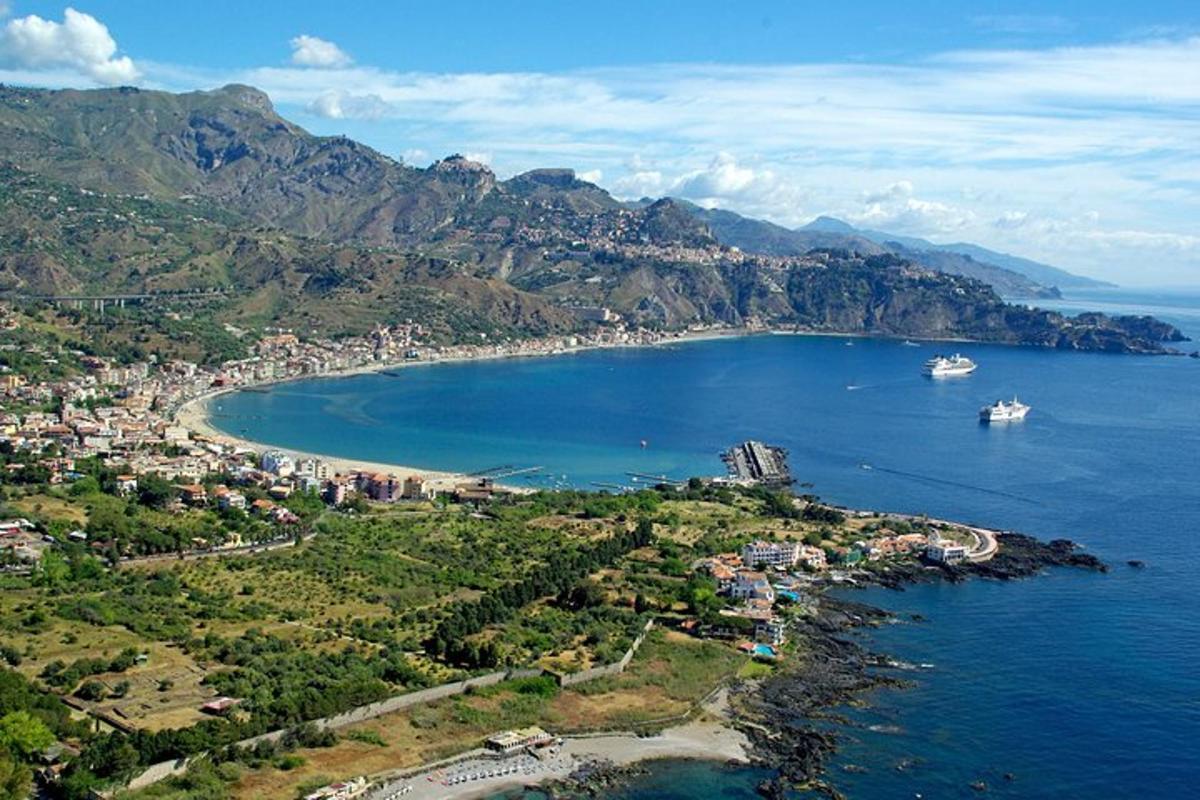 an aerial view of a bay with boats in the water