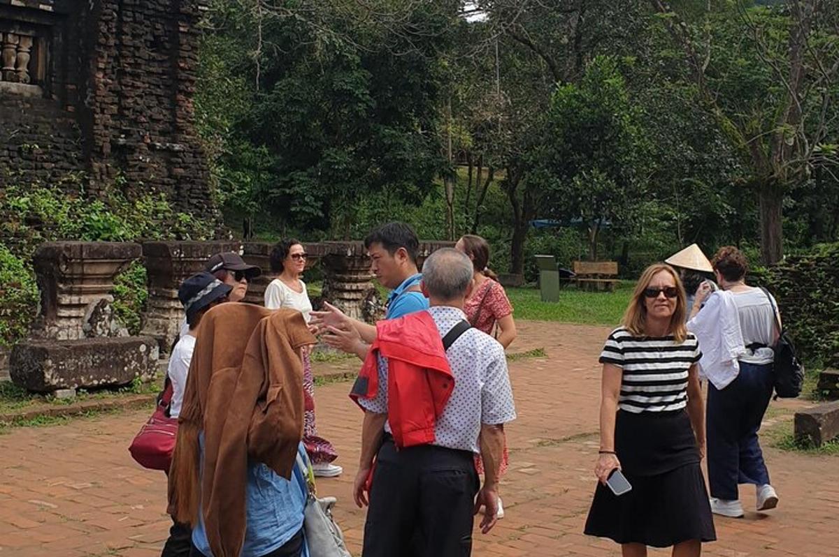 a group of people walking around in a park
