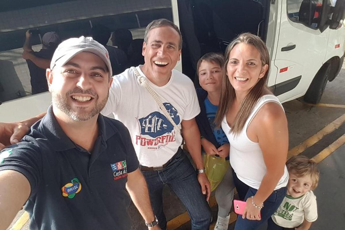 a group of people standing in front of a van