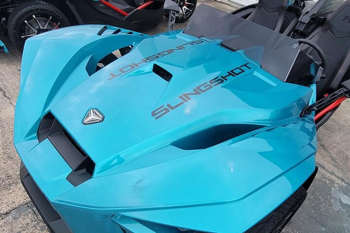 a blue motorcycle sitting on top of a table