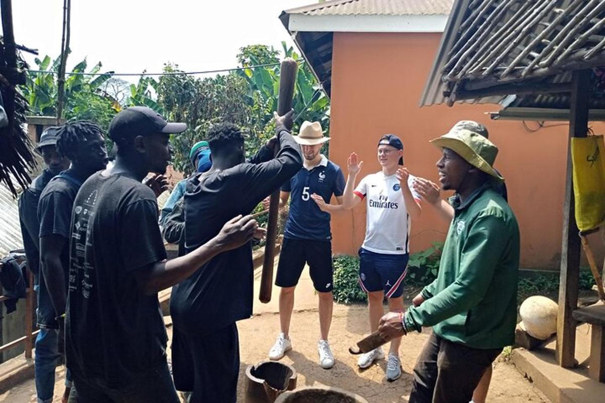 a group of people standing around a man holding a baseball bat