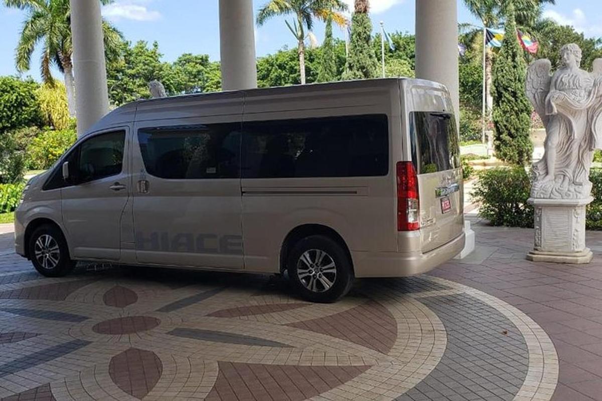 a silver minivan parked on a tiled floor