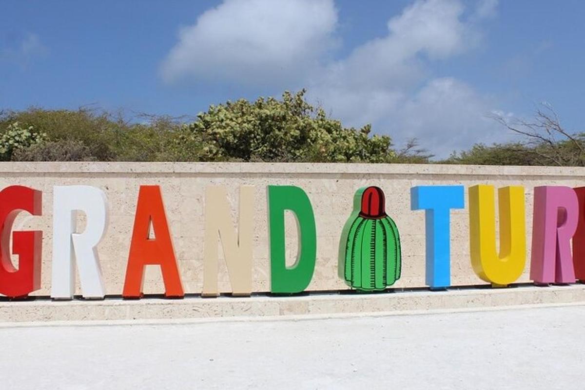 a sign that says grand tour on a wall