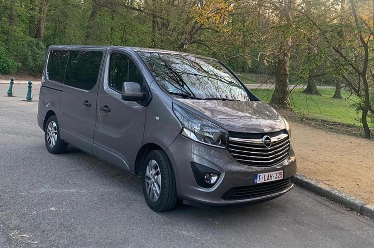 a silver van parked in a parking lot
