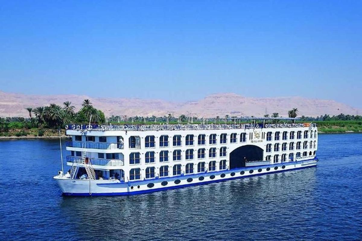 a large boat in the water with a bridge
