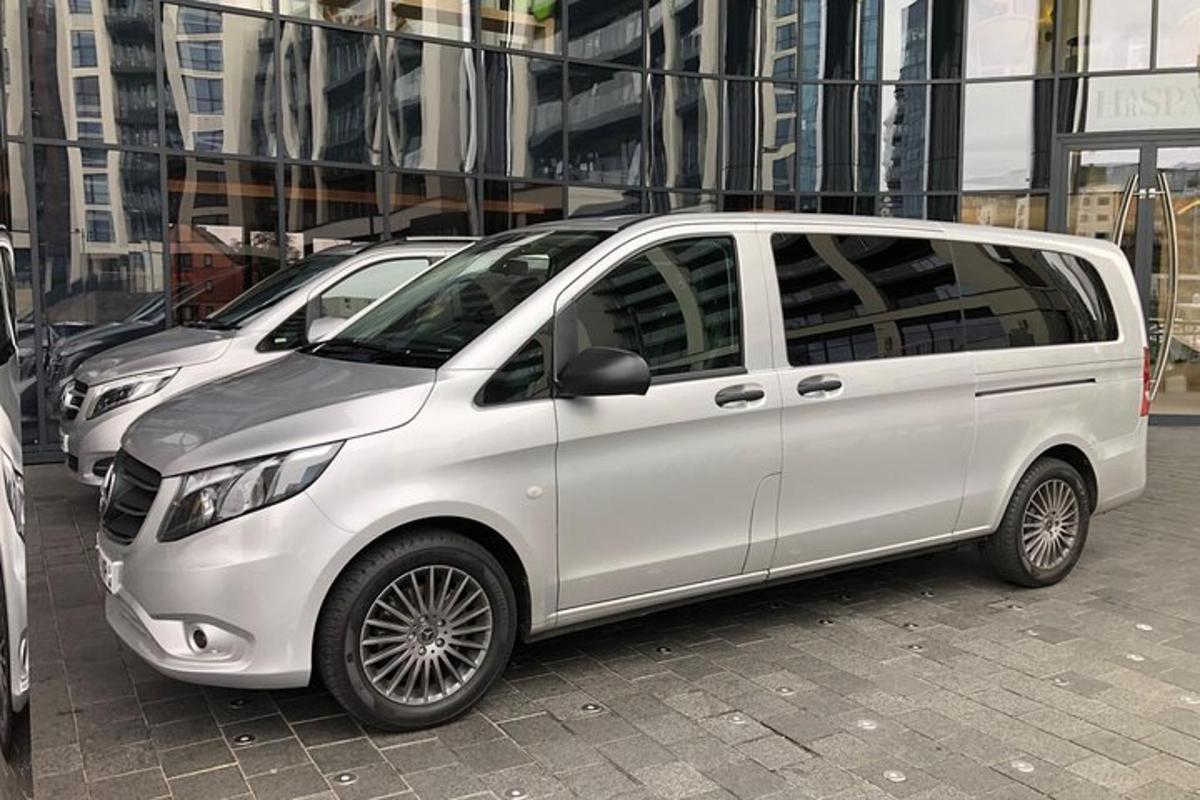a white van parked in front of some buildings