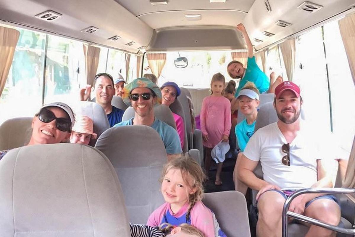a group of people sitting on a bus